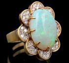 Lady's Custom Designed 14K Yellow Gold Ring with a 10 Ct. Cabochon Opal and Pavé Set Diamonds