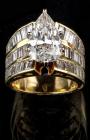 Exquisite Lady's 18K Yellow Gold and 4½ Carat Pear Shaped Diamond Flanked by 36 Diamond Baguetts